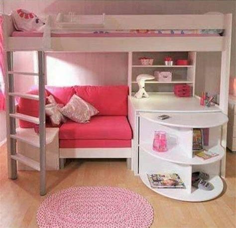 A Pink And White Bunk Bed Sitting Next To A Desk