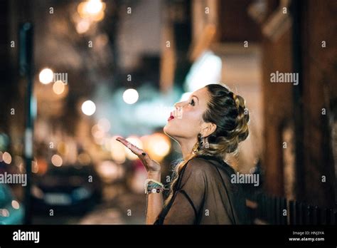 Young Woman Blowing Kiss Side Hi Res Stock Photography And Images Alamy