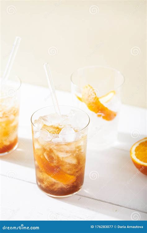 Cold Brew Coffee Mocktail With Orange Peel And Glass Straw Stock Image