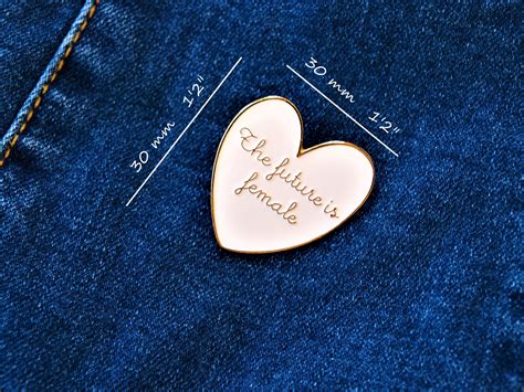 the future is female meassures enamel pin heart