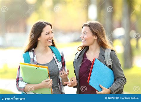 Two Students Talking Walking In The Street Stock Image Image Of