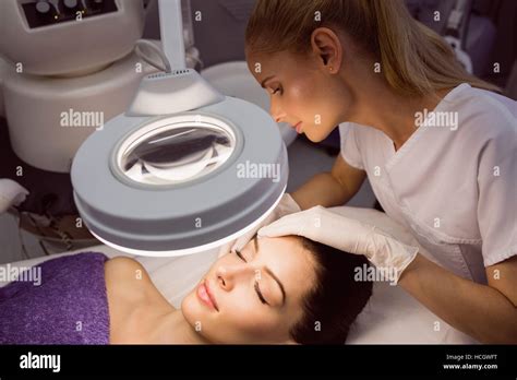 Dermatologist Examining Female Patient Skin Stock Photo Alamy