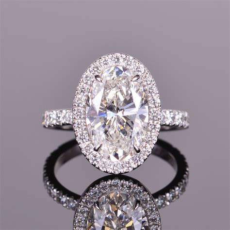 I would love to see some pics! Custom made oval diamond engagement ring with diamond halo ...