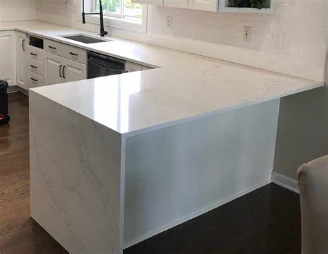 Sticking to a monochromatic color scheme can instantly make any kitchen feel modern. Calcutta quartz | Countertop Surface Solutions