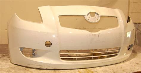 So far i have found 2 bolts under the rear tailgate and when removed the bumper is still attached. 2007-2008 Toyota Yaris 2dr hatchback; w/fog lamps Front Bumper Cover -BUMPER MEGASTORE