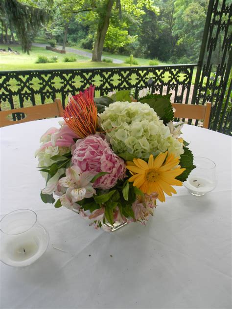 Floral Centerpiece Using Hydrangea Peonies Protea Gerber Daisies By