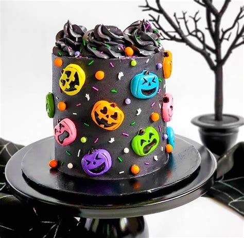 A Decorated Halloween Cake With Sprinkles And Decorations