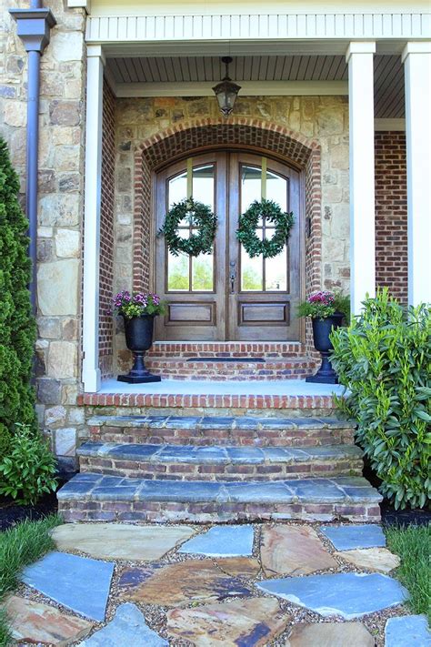 Double Arched Front Doors Stone Path Urn Planters Arched Front Door