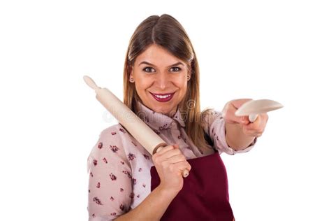 Woman Holding A Kitchen Spoon And Baking Rolling Pin Stock Image