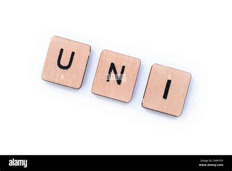 The Word Uni Spelt With Wooden Letter Tiles On A White Background
