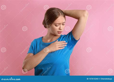 Young Woman With Sweat Stain On Her Clothes Pink Background Using