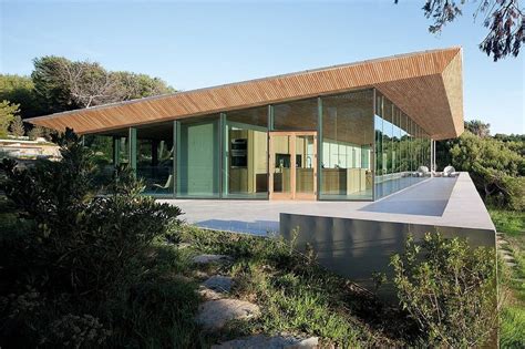 Concrete And Glass Home With Main Level Wood Ceiling