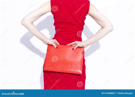 Closeup Portrait Of Winsome Concentrated Confident Caucasian Business Woman In Red Dress Posing