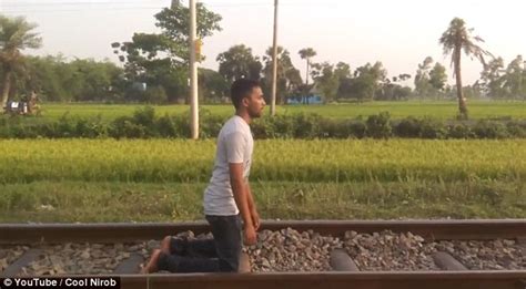Man Lies Down On Railway And Lets Train Ride Over Him Captured On Video