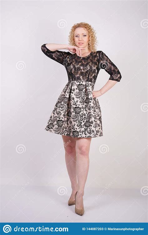 Pretty Blonde Adult Woman Wearing Lace City Dress And Posing On White Background Isolated