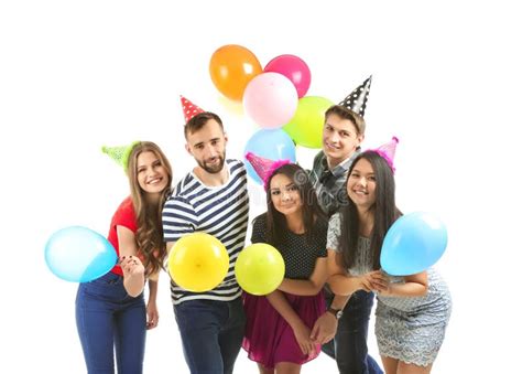 Young People In Birthday Party Caps With Balloons On White Background