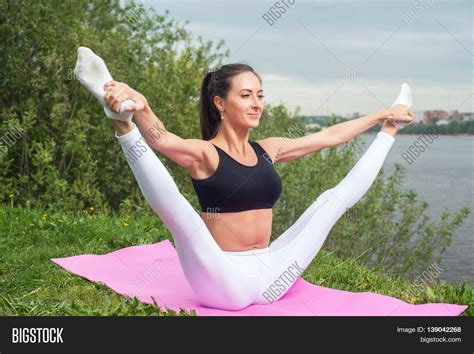 woman holding legs image and photo free trial bigstock