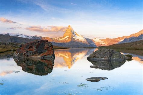 Matterhorn Lit By Sunrise Reflected In The Calm Water Of Lake Stellisee