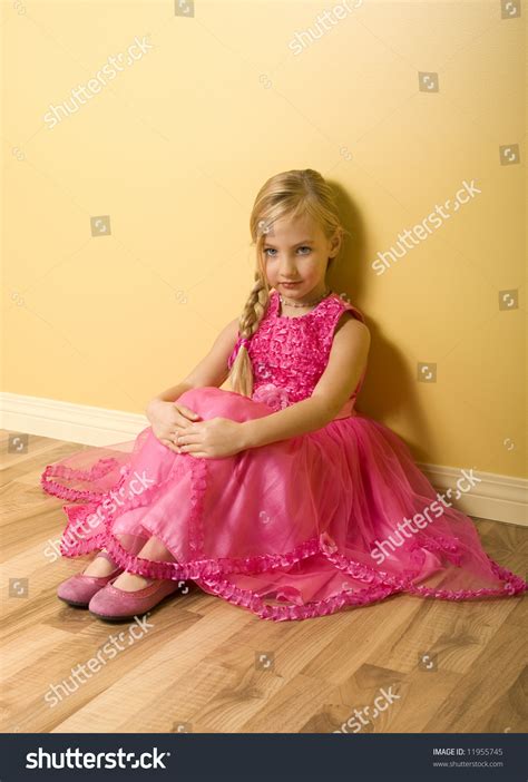 Adorable Little Girl Sitting In Pink Princess Dress Stock Photo