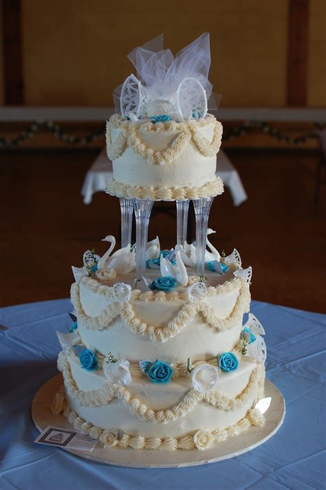 The wedding cake you select should not only be delicious, but represent your wedding itself. O Taste & See Cakes: Blue Flowers & White Swan Wedding Cake