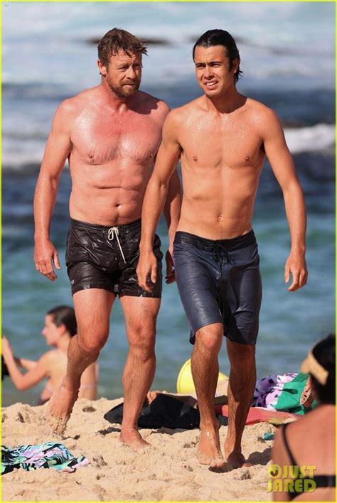 Simon Baker Goes Shirtless During Beach Day With 22 Year Old Son Claude See Photos Simon