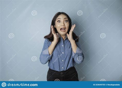 Portrait Of Young Asian Woman Isolated By Blue Background Feeling