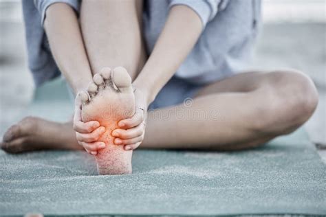 Foot Injury And Pain With A Woman Holding Her Sole During Fitness