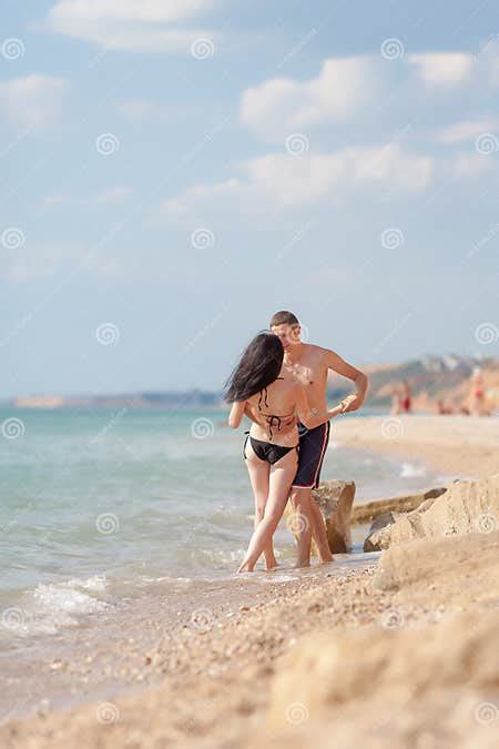 romantic couple kissing on seashore stock image image of brunette open 64294119