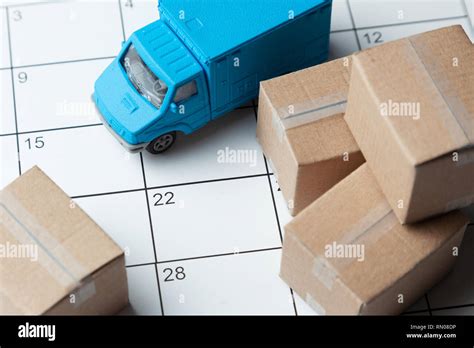 Moving Day Calendar For Note With Cardboard Boxes And Truck Stock