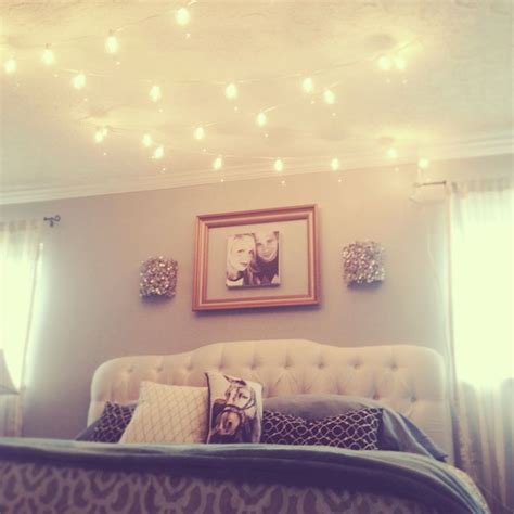 Hang two strands of globe lights low over your eating space for statement lighting at a fraction of these clips are hanging across her bedroom wall and they look great! globe string lights above the bed | Dream Home | Pinterest ...
