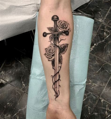 50 Sharp Sword Tattoo Designs Symbolism Of Warriors