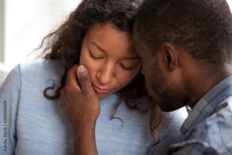 Loving African American Husband Apologizing Comforting Sad Wife Caring