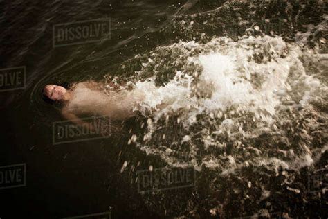 Boy Swimming In River Stock Photo Dissolve