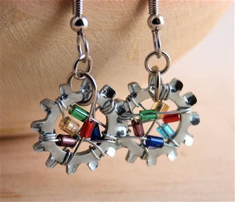 A Pair Of Colorful Earrings Hanging From A Persons Ear