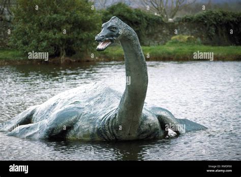 Nessie The Monster As A Sculpture In The Pond Of A Restaurant In