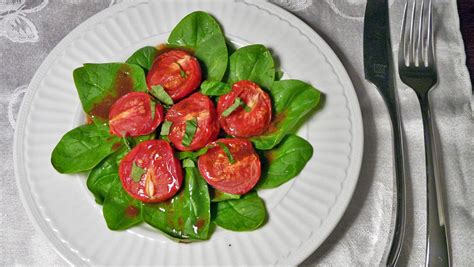 Roasted Campari Tomatoes Over Baby Spinach