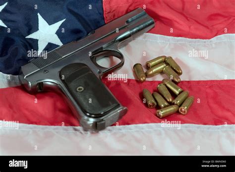 Hand Gun And Bullets On An American Flag Stock Photo Alamy
