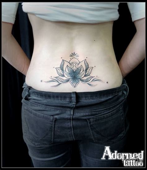 lotus flower tattoo lower back