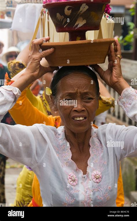 Woman Taking Part In A Traditional Funeral And Cremation Ceremony In