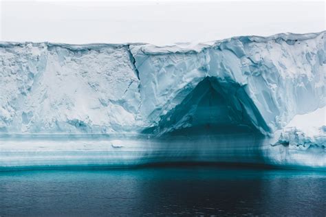 Ice Cave In Iceberg In Arctic Waters Of Greenland Landscape