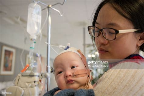 Supportive Mom Caring For Her Sick Baby High Res Stock Photo Getty Images