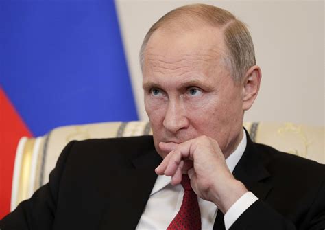 President vladimir putin cups his ear to listen to a question as he departs after a summit on the ukraine crisis at the elysee palace in paris. Putin Doesn't Blame Trump for Quitting Paris Climate Deal ...