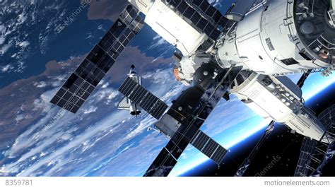 Space Station And Space Shuttle Orbiting Earth Stock