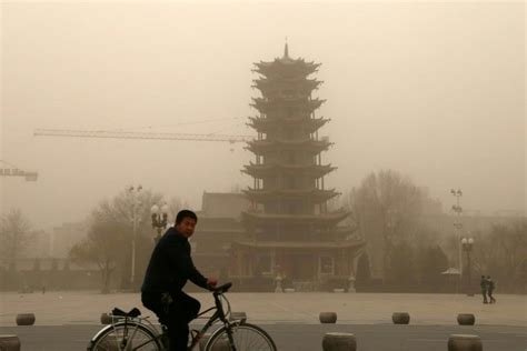 Northwest China Hit By Sandstorm As Beijing Is Smothered In Smog