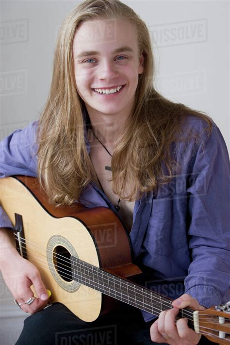 Caucasian Teenage Boy Playing Guitar Stock Photo Dissolve