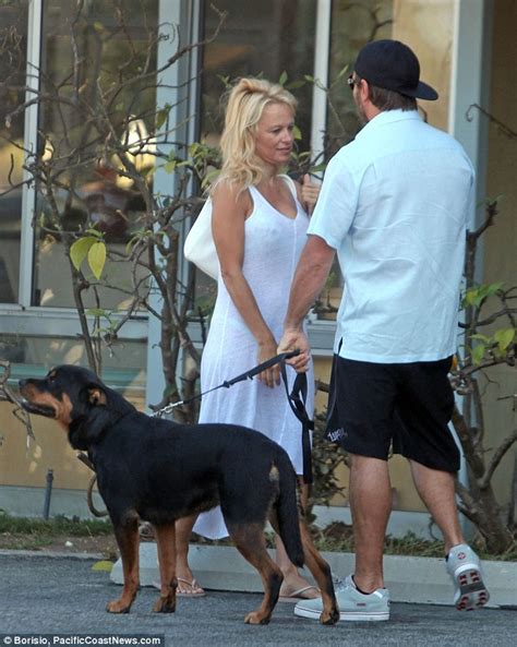 Pamela Anderson Flashes Her Derriere In Sheer Dress As She Embraces