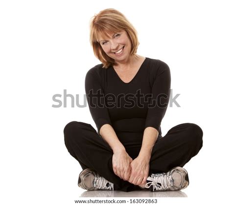 Mature Woman Wearing Black Workout Outfit Stock Photo