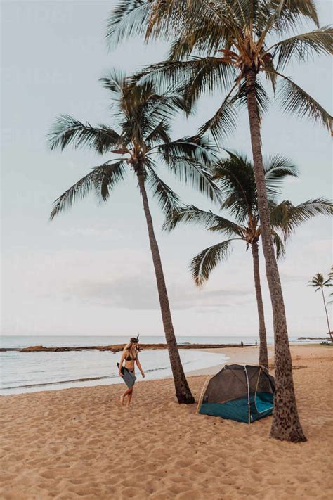 Scuba Diver By Tent On Sandy Beach Princeville Hawaii Us Stock Photo