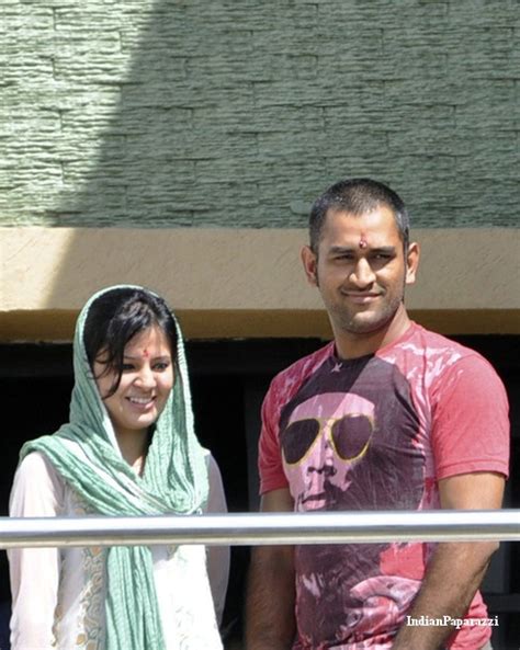 Dhoni And His Wife Sakshi Spotted At The Balcony Of Their Home In