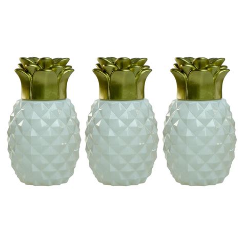 Great for your backyard tiki bar! TIKI 6.5 in. Pineapple Paradise Glass Table Torch White ...